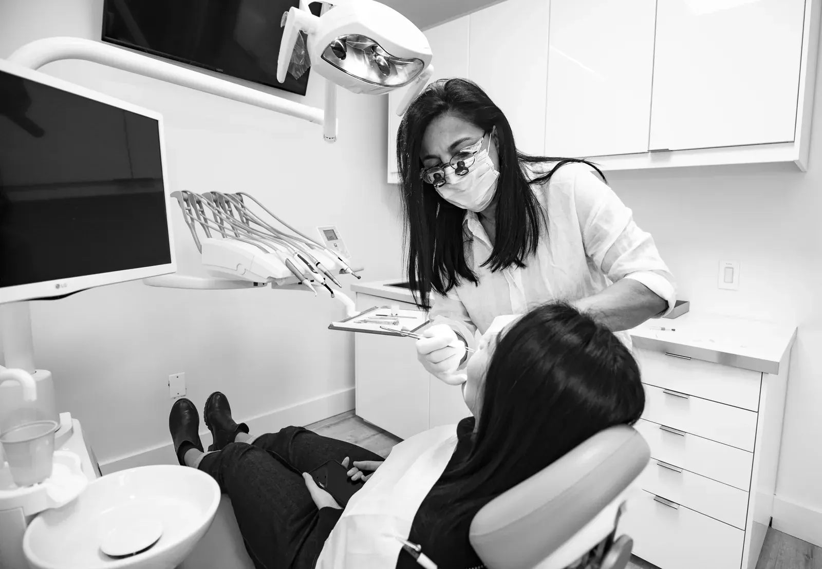 Dr. Moezinia reviewing a digital smile design with a patient